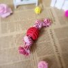 pelota con cuerda de doble nudo rojo presentación