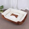 cama para perro huesos marrón